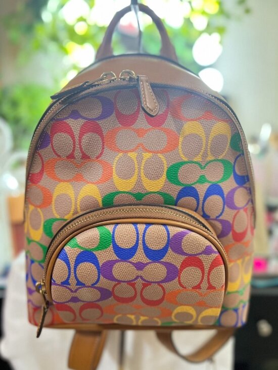 coach backpack rainbow Hitch in Signature Canvas  Club de Mode Signature coated canvas and smooth leather Inside zip and multifunction pockets Double zip closure fabric lining Handle with 2 1/4 drop Outside zip pocket Adjustable shoulder straps 10 3/4 (L) x 12 1/2 (H) x 4 3/4 (W) The Coach Foundation continues to partner with the Hetrick Coach Pride Court Backpack Rainbow
